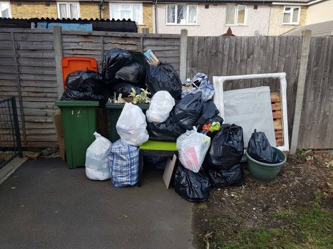 Demolition site in Kingston with waste removal equipment